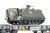 Piko 96280 H0 - Wagon platforma typu Slmmnps z transporterem M113, SBB-CFF, ep.V